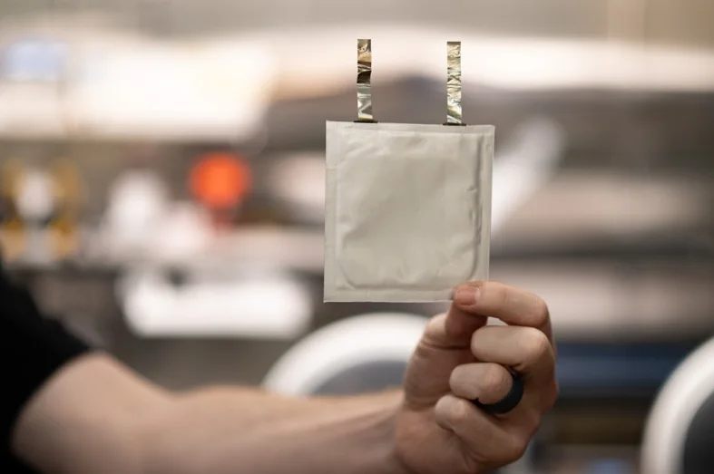 C-BATT composite pouch cell prototype held up in the lab